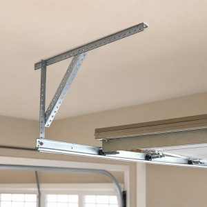 Close-up of a garage door track and metal support bracket installed on a residential garage ceiling, showing the garage door track system and hardware components for smooth door operation.