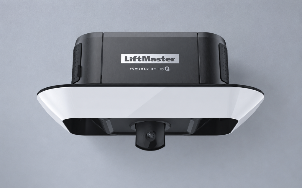 LiftMaster 87504-267 Secure View smart garage door opener with integrated camera, shown in a modern ceiling-mounted installation featuring a clean, cool-toned background that highlights advanced residential garage security and remote monitoring capabilities.